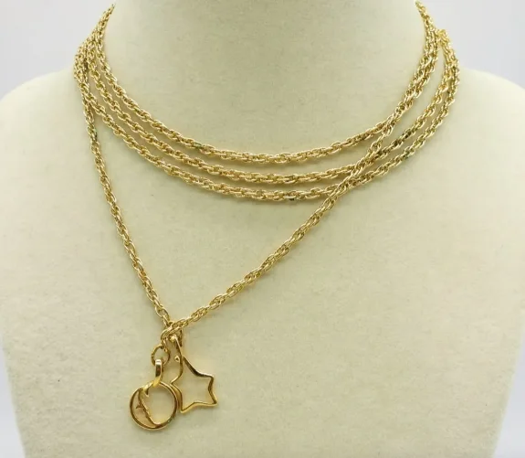 Dragon flare necklaces -Estate Collection - Necklace - Gold Tone Lariat with Star and Moon.