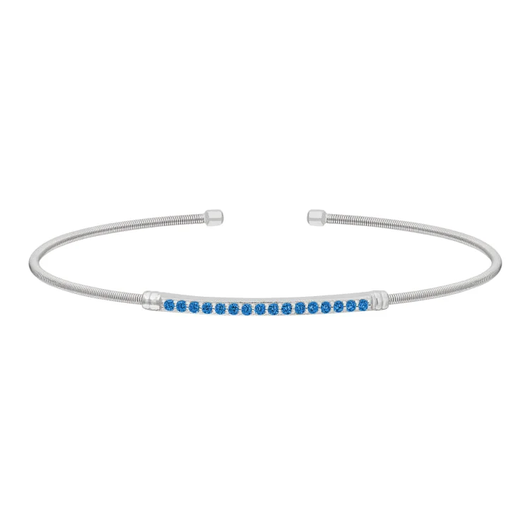 Ladies rolling wave bracelets -Rhodium Finish Sterling Silver Cable Cuff Bracelet with Simulated Blue Zircon Birth Gems - December