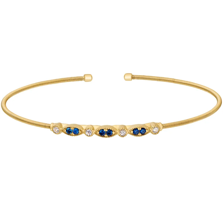 Ladies galaxy swirl bracelets -Gold Finish Sterling Silver Cable Cuff Bracelet with Simulated Blue Sapphire and Simulated Diamond Marquis & Round Design