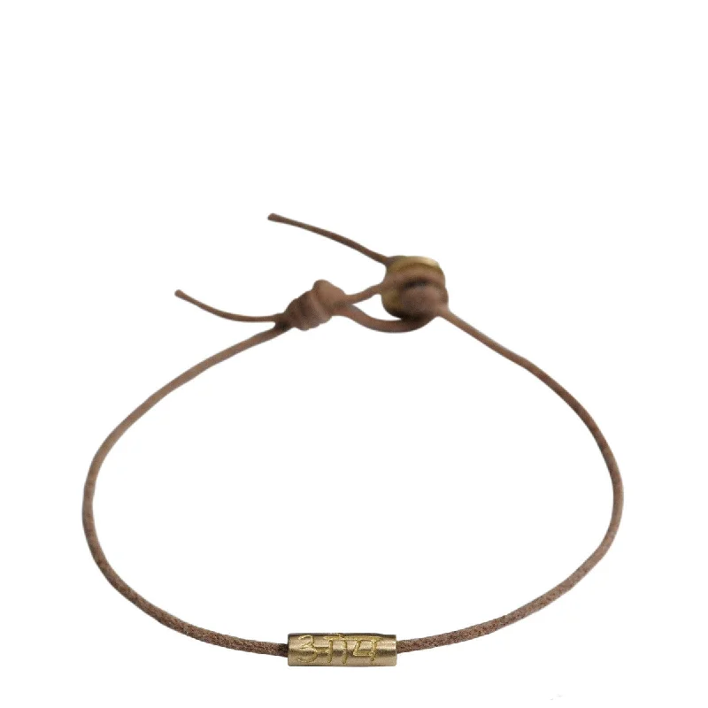 Ladies romantic heart bracelets -10K Gold Om Tube Bracelet on Natural Cord