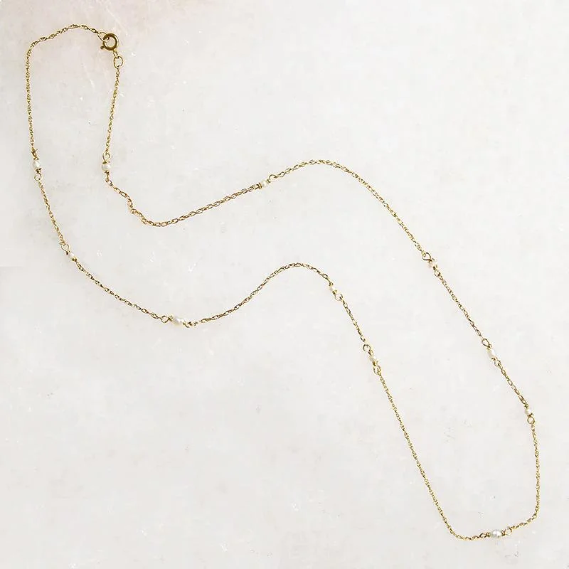 Family joy necklaces -Tiny Pearl Stations Gold Necklace by brunet