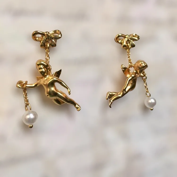 Ladies Earrings Curved Spark-Flying cherub Pearl Earrings by Bill Skinner