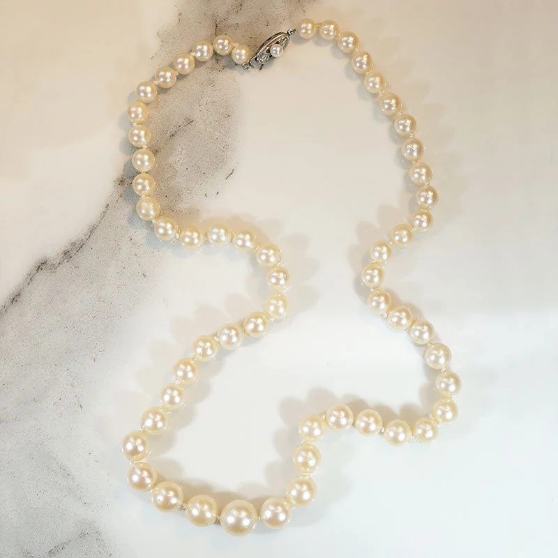 Resilient steel necklaces -Princess Length Graduated Pearl Necklace with Silver Clasp