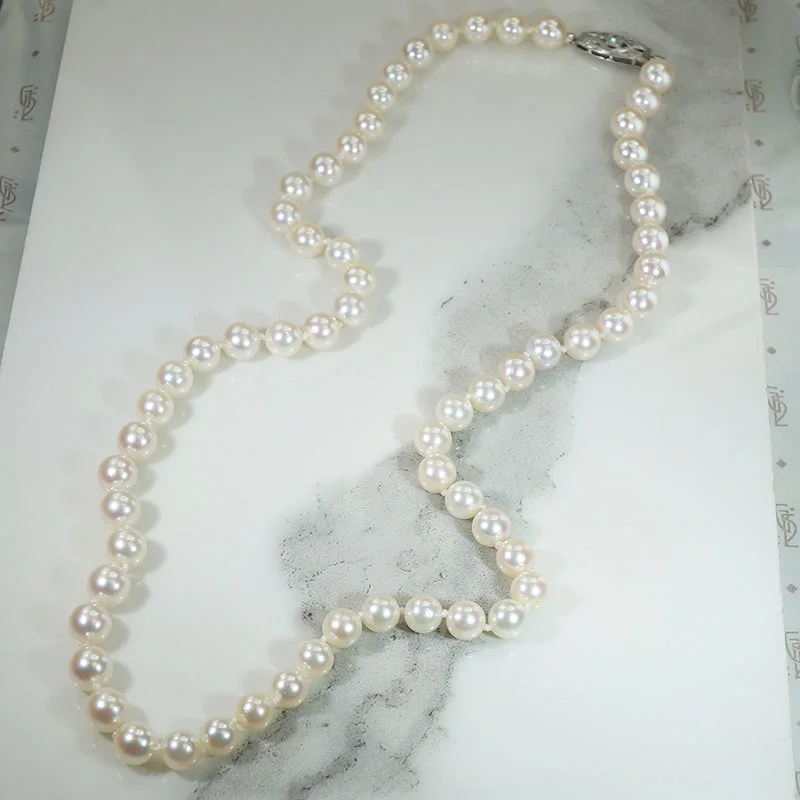 Lunar charm necklaces -Matinee Length Pearl Necklace with Decorative Diamond Clasp