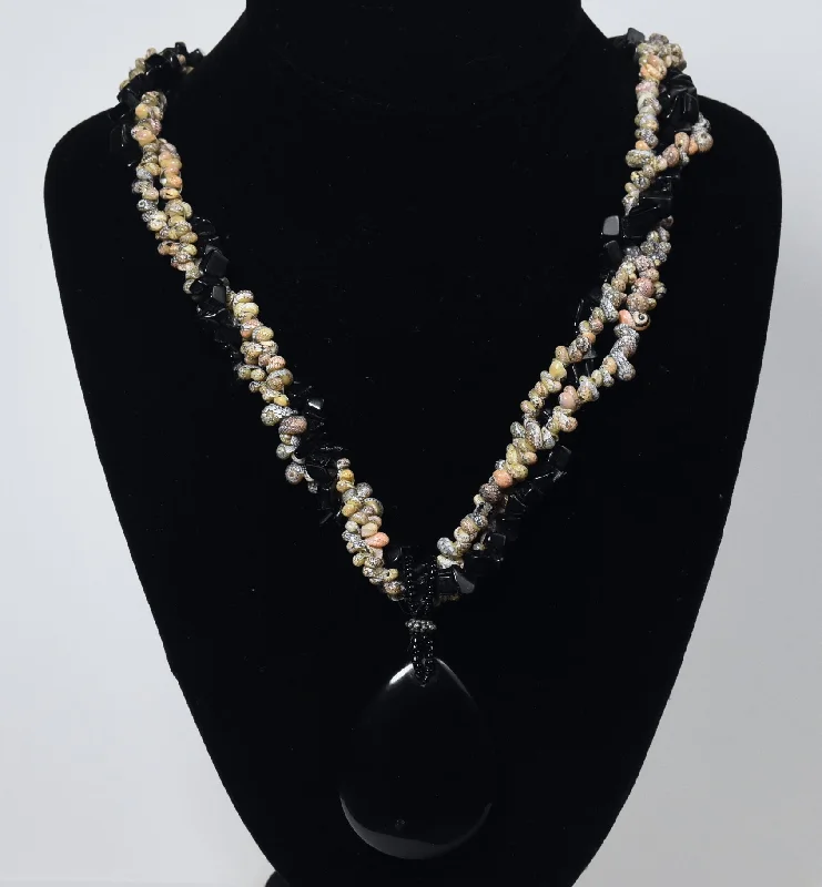 Eastern mystique necklaces -Triple Strand Shell and Black Onyx Necklace with Black Onyx Pendant