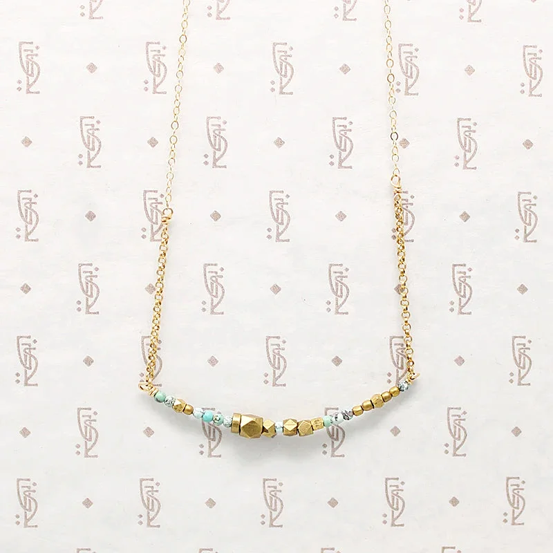 Astral gleam necklaces -Turquoise & Brass Bead Arc Necklace by Brin