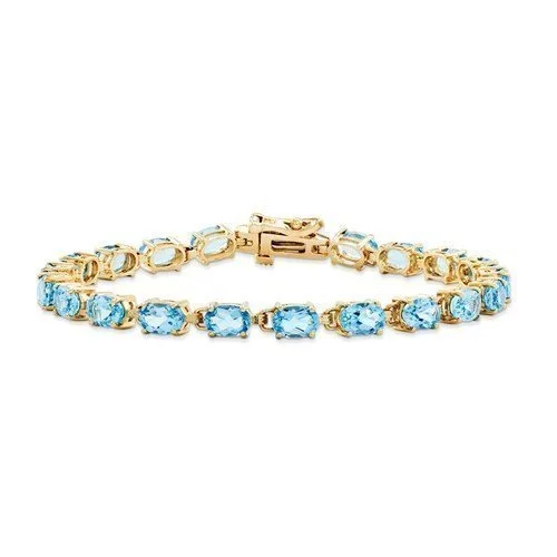 Ladies peaceful flow bracelets -14KT YELLOW GOLD 11 CARAT SWISS BLUE TOPAZ BRACELET